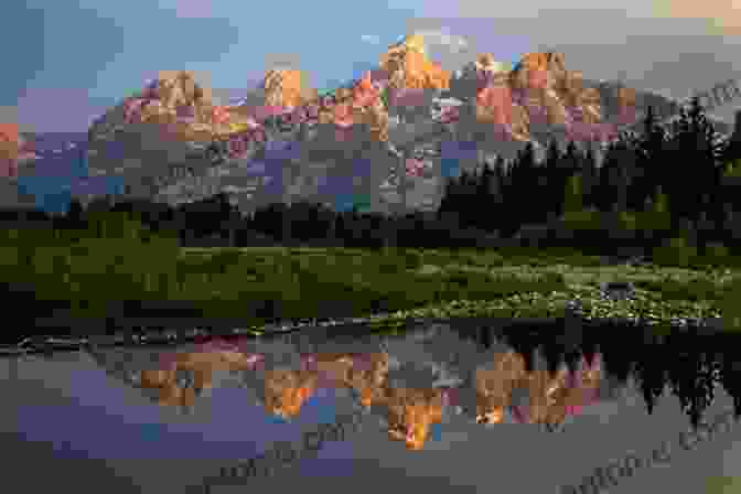 A Panoramic View Of The Grand Tetons, With Their Jagged Peaks Rising Above A Tranquil Lake. Great Ranches Of Today S Wild West: A Horseman S Photographic Journey Across The American West