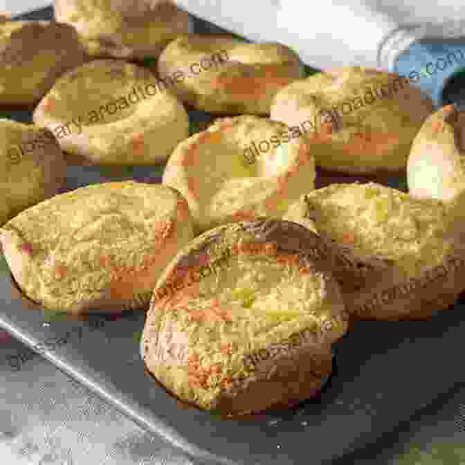 Golden Yorkshire Puddings Rising Majestically In A Baking Tray Traditional British Pudding Recipes (Traditional British Recipes 2)