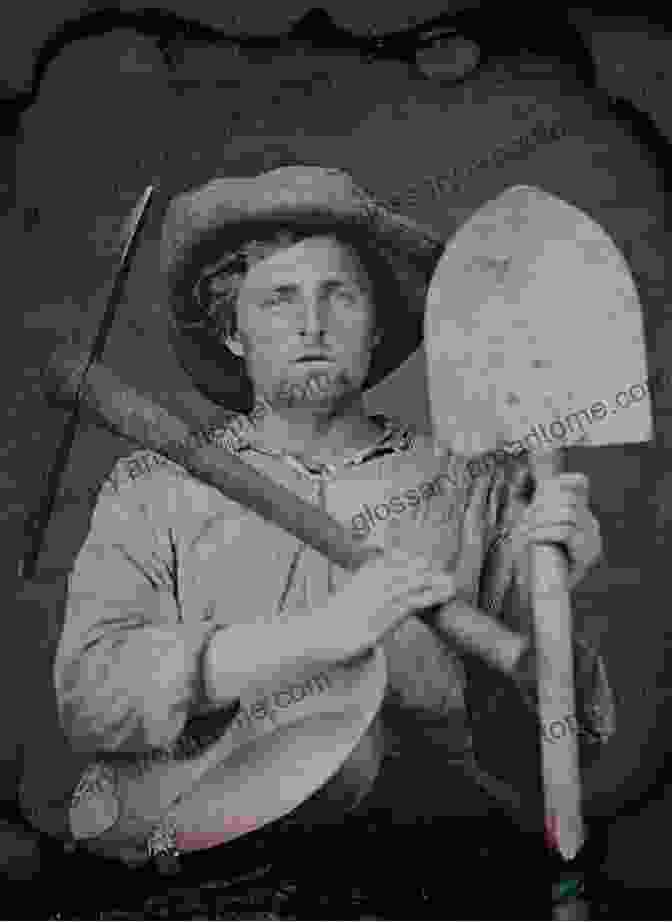 Michael Johnson Standing In Front Of A Gold Mine With A Pickaxe. Gold Rush Michael Johnson