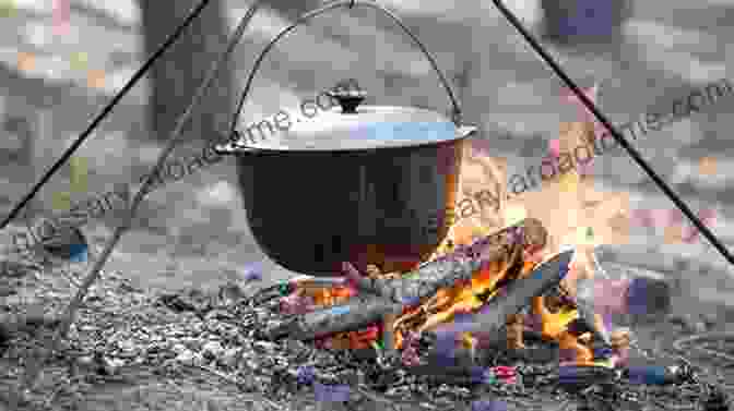 Person Cooking Over A Campfire, Surrounded By Simple Tools Going Off The Grid: The How To Of Simple Living And Happiness (Off The Grid 1)